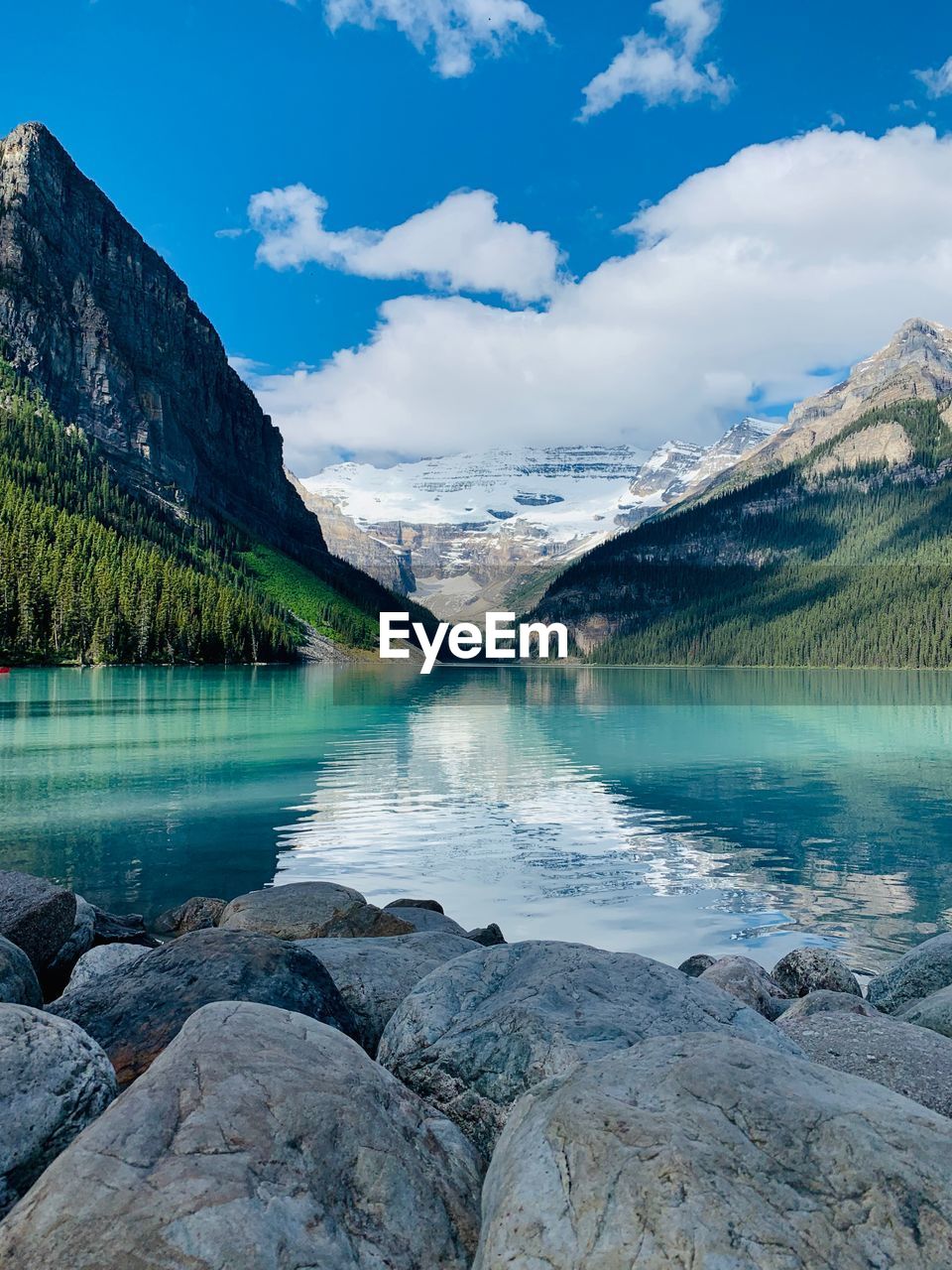 Scenic view of lake against blue sky