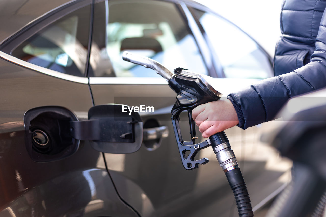 close-up of man washing car