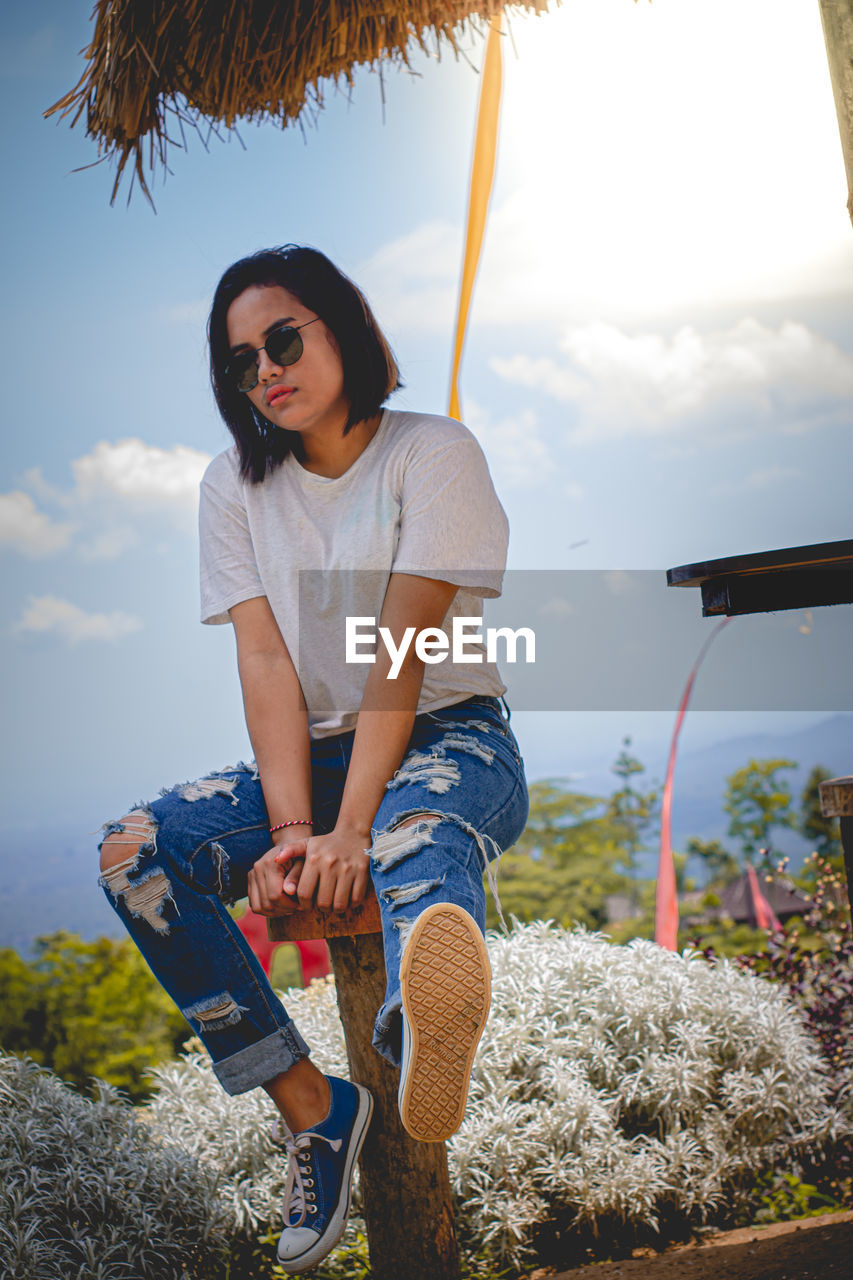 young woman Woman Woman Portrait Women Of EyeEm Spraying Full Length Standing Protective Glove Holding Front View Sky Cloud - Sky Casual Clothing Garden Hose Gardening Glove Gardening Equipment Watering Rake Gardening Florist Petunia Community Garden Sprinkler