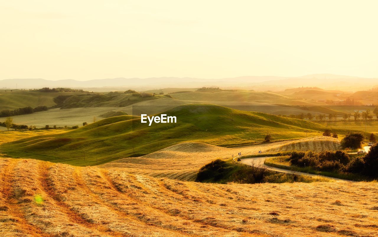 SCENIC VIEW OF LANDSCAPE AND MOUNTAINS AGAINST SKY