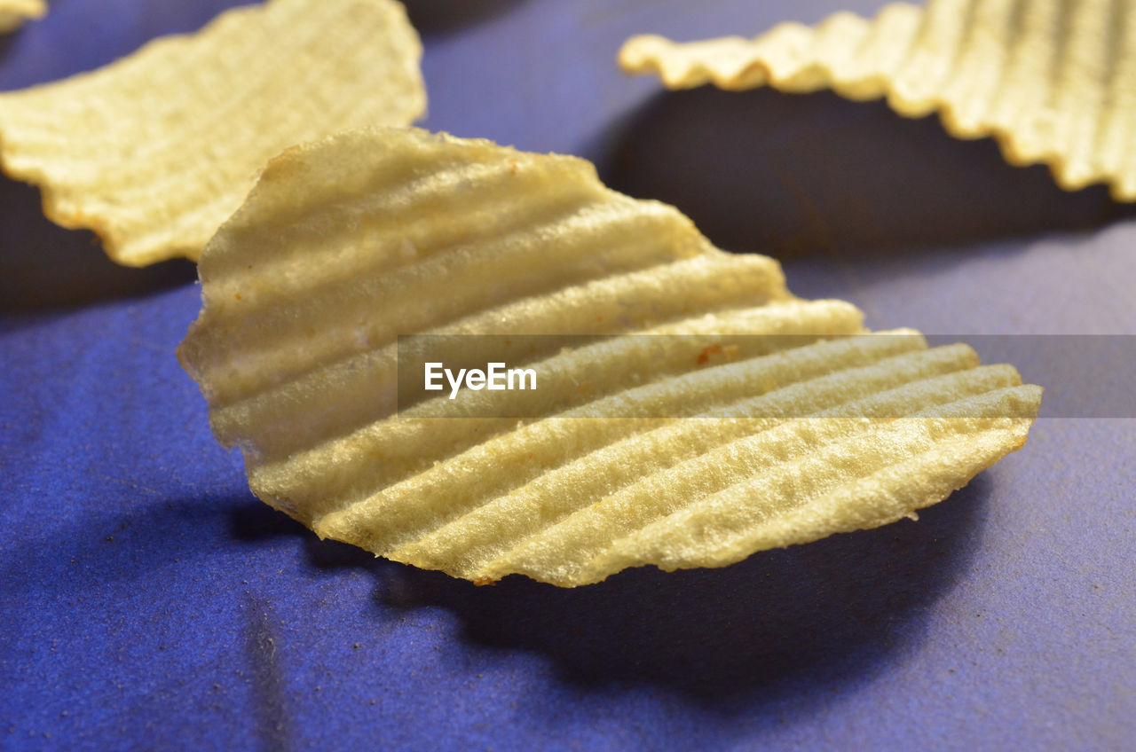 Close-up of potato chips on table