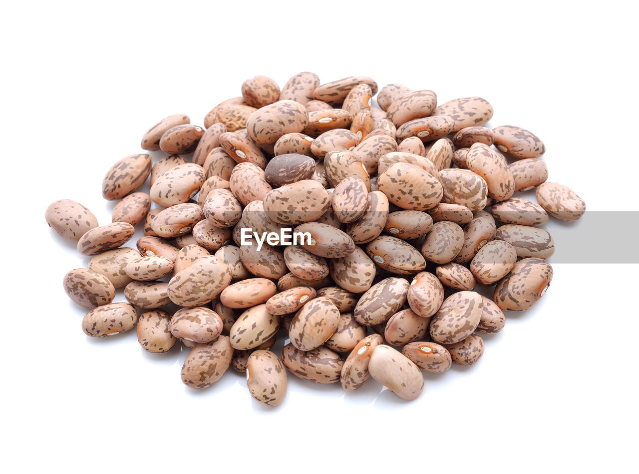 HIGH ANGLE VIEW OF ROASTED COFFEE ON WHITE BACKGROUND