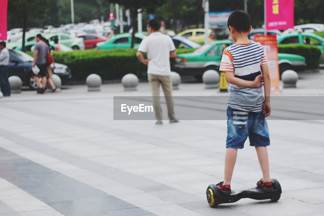 Boy in segway on street