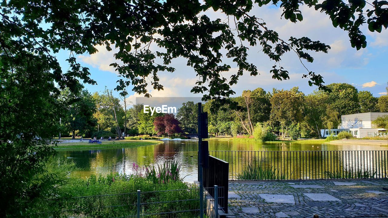 GAZEBO BY LAKE AGAINST SKY