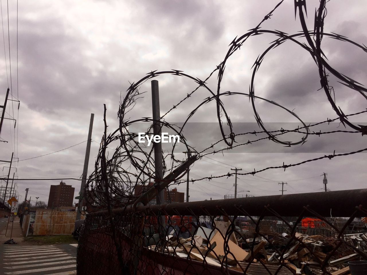 FENCE SEEN THROUGH CHAINLINK FENCE