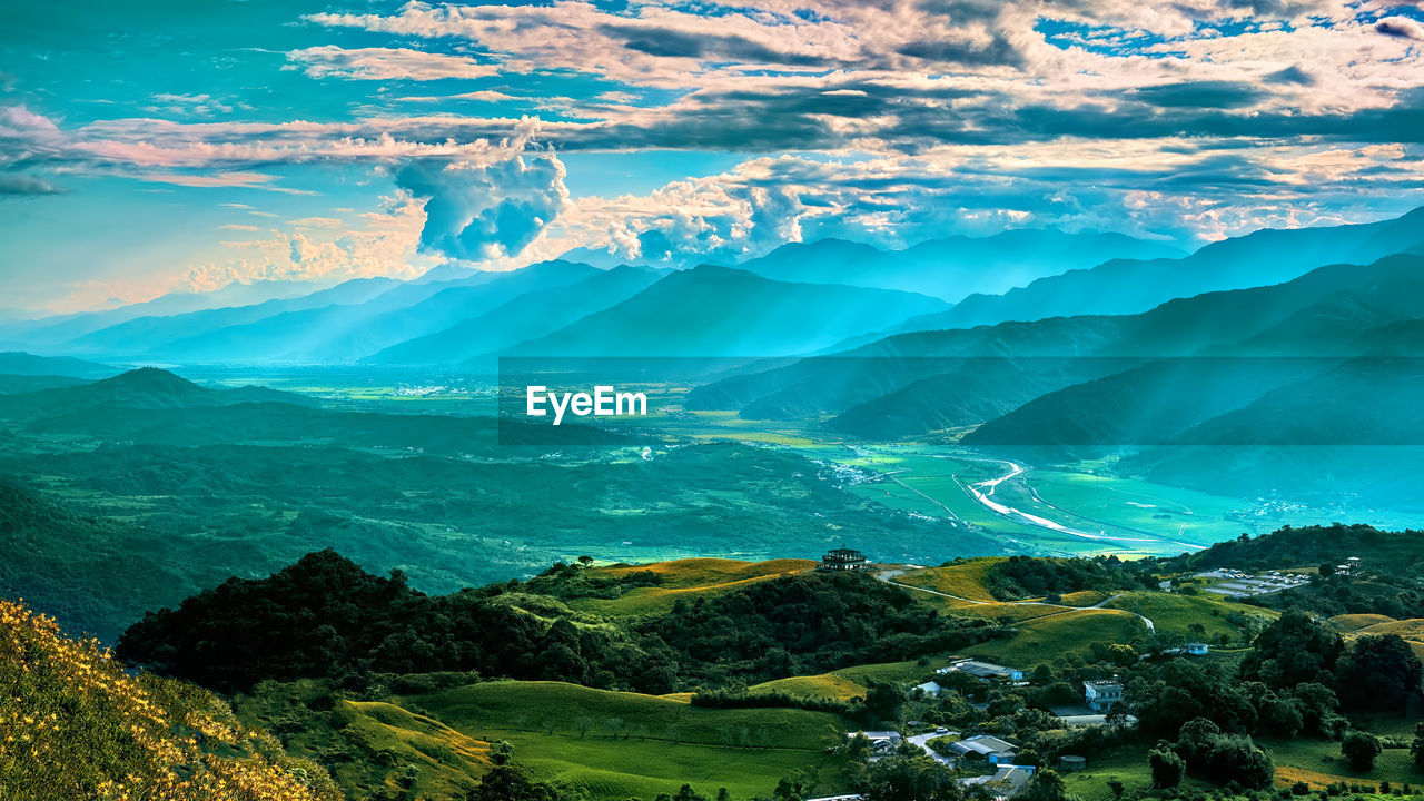 Aerial view of landscape and mountains against sky