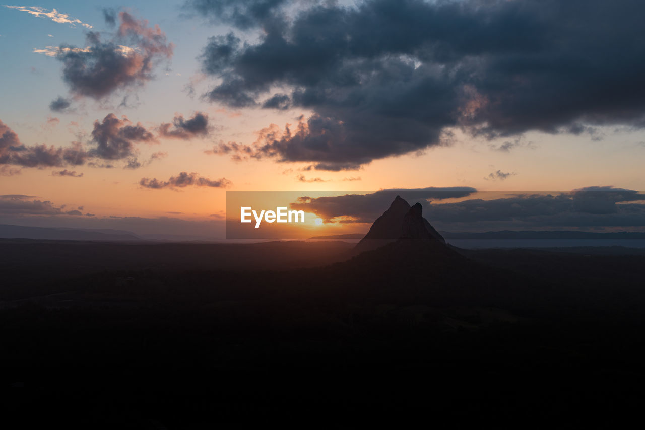 Scenic view of silhouette landscape against sky during sunset