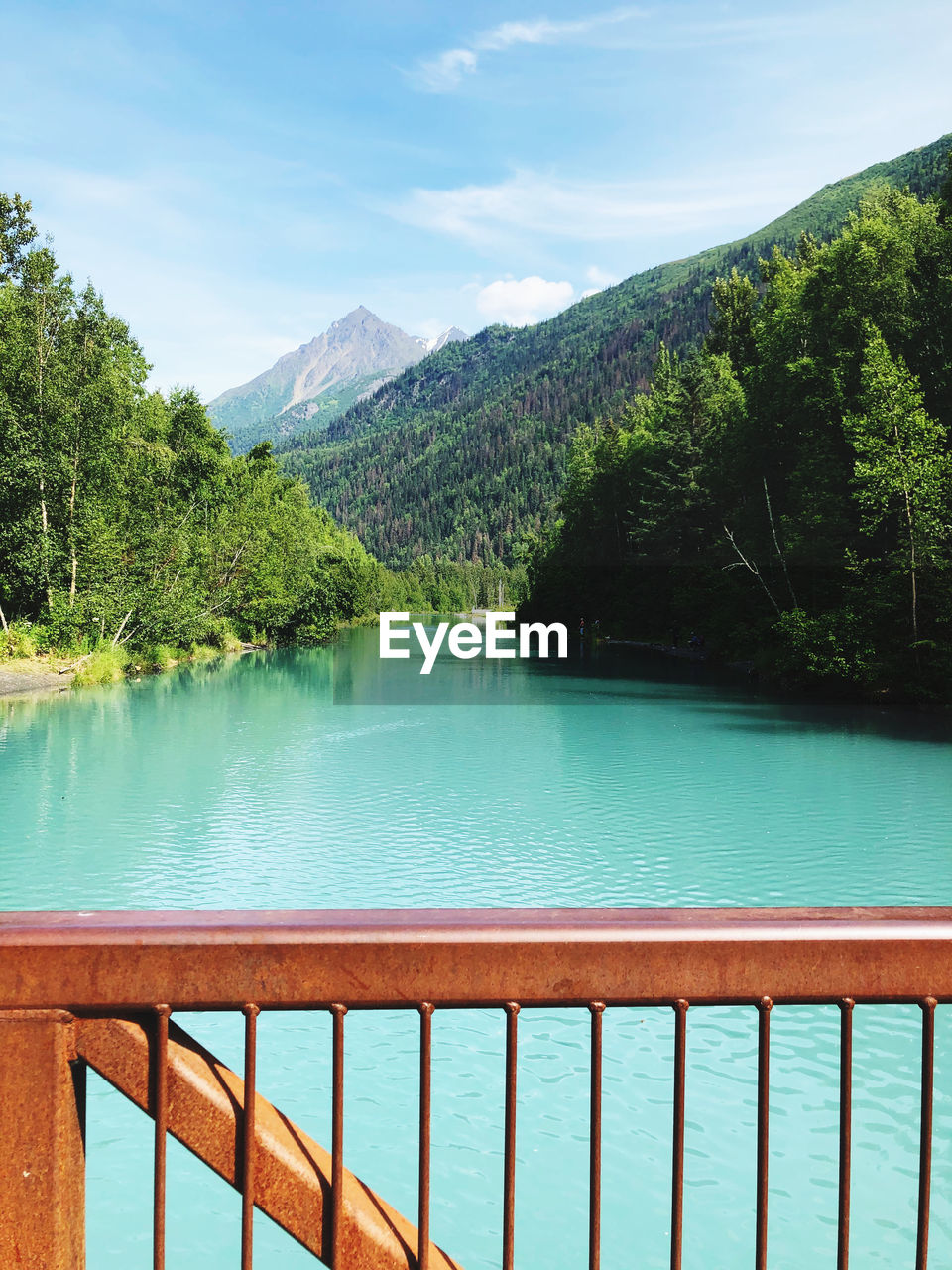 Scenic view by lake against sky