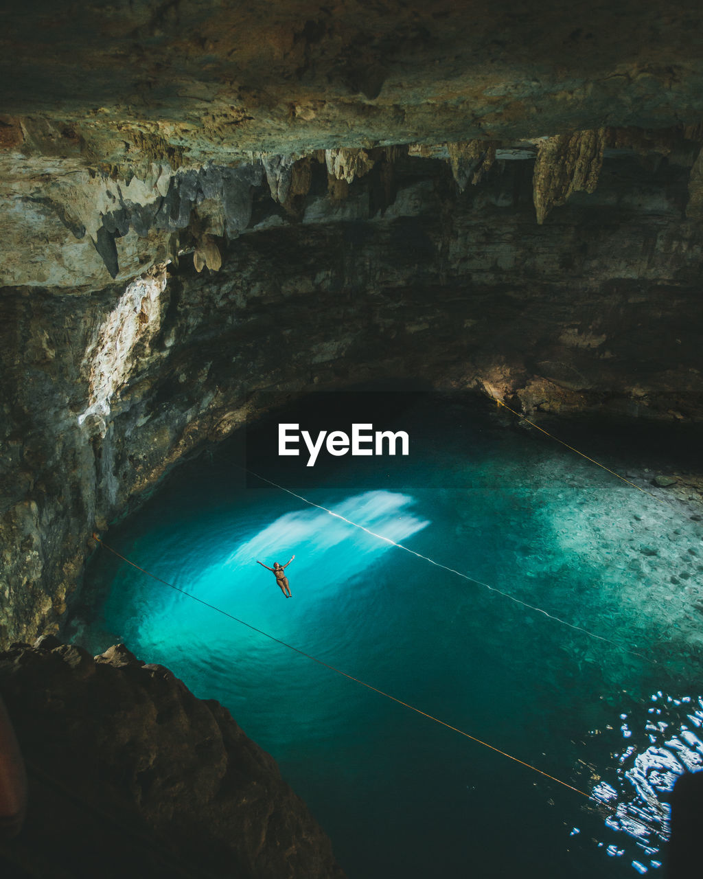 High angle view of woman swimming in sea