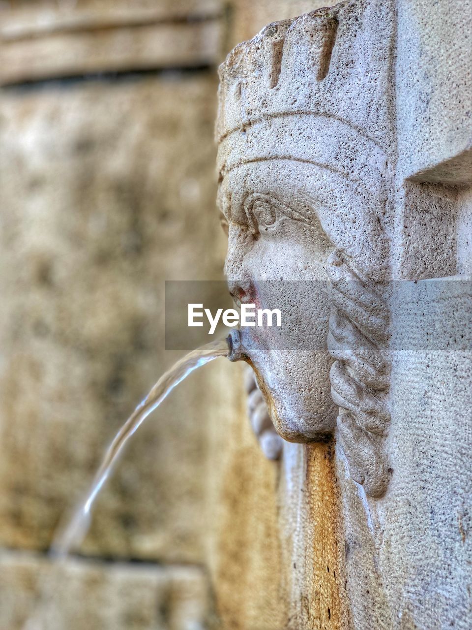 Close-up of water coming from statue 