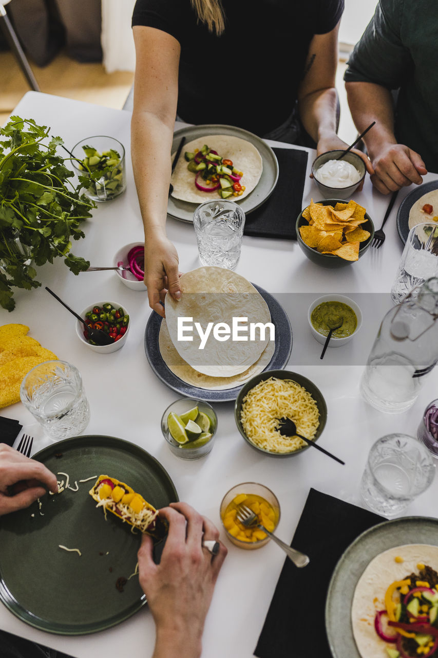 High angle view of people having mexican food