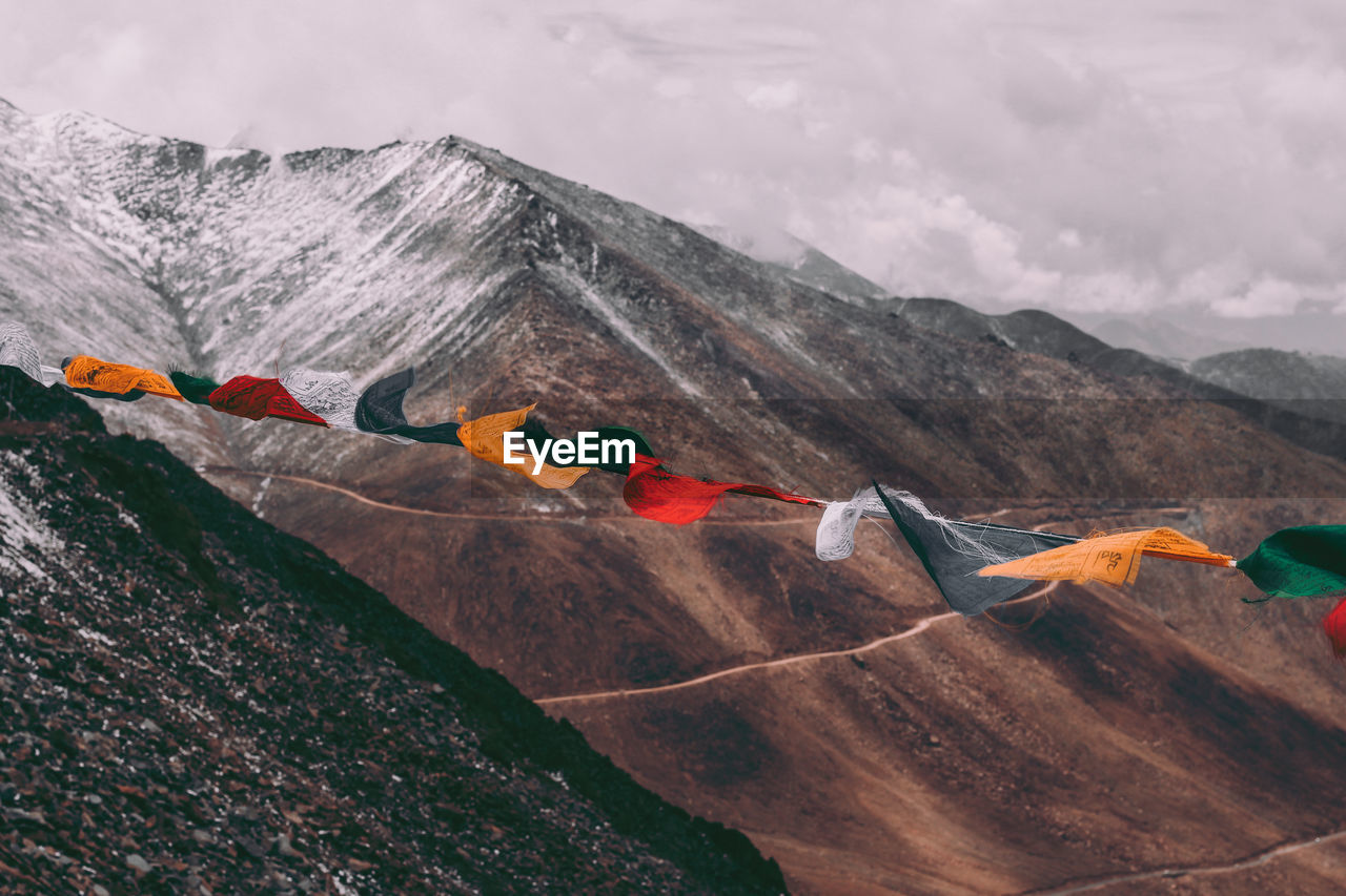 View of buntings against snowcapped mountains 