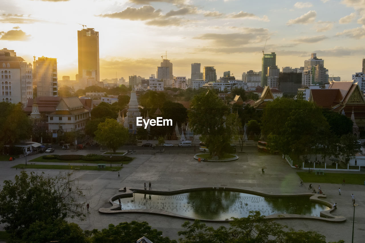 Buildings in city at sunset