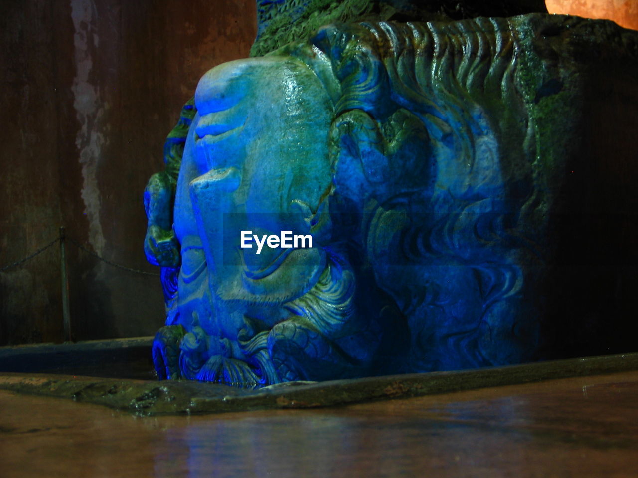 CLOSE-UP OF BLUE STATUE