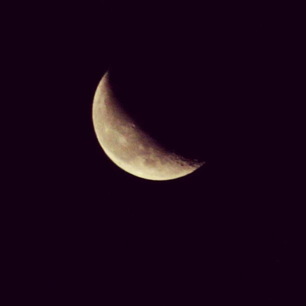 LOW ANGLE VIEW OF MOON IN SKY AT NIGHT