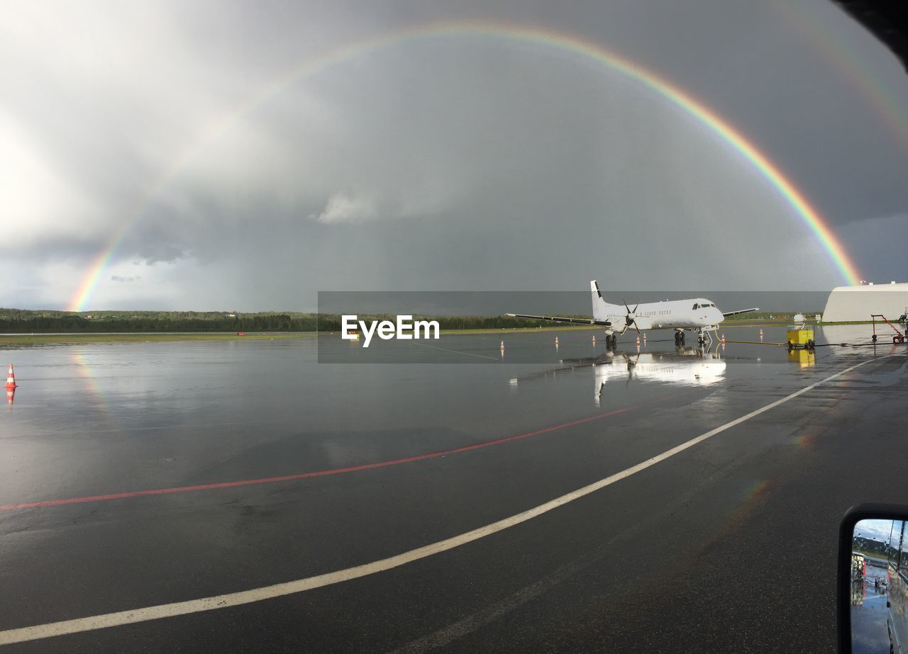 View of rainbow over calm sea