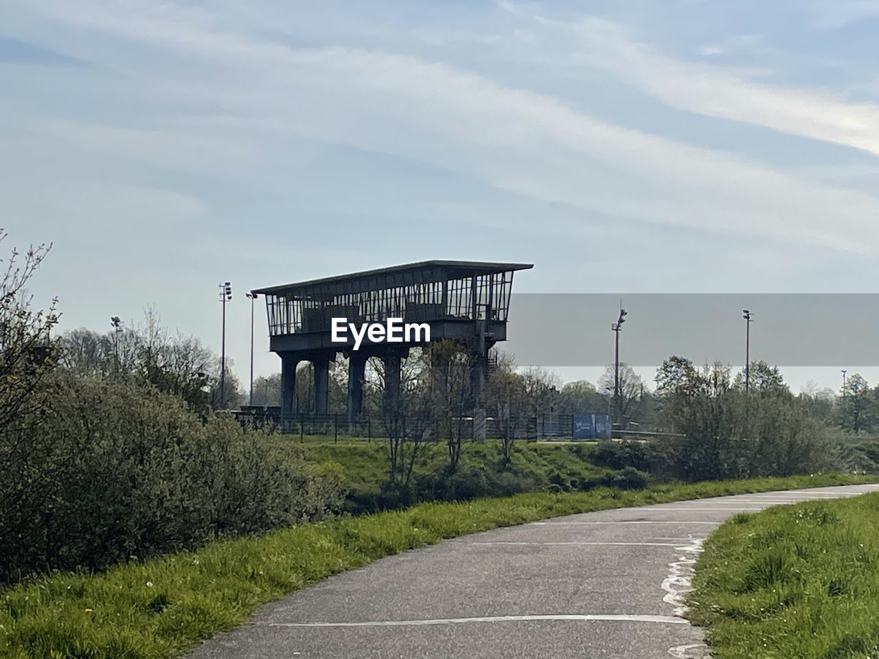 transport, highway, sky, road, plant, transportation, architecture, nature, cloud, built structure, rural area, no people, tree, infrastructure, day, walkway, grass, bridge, outdoors, sign, viaduct, the way forward, text