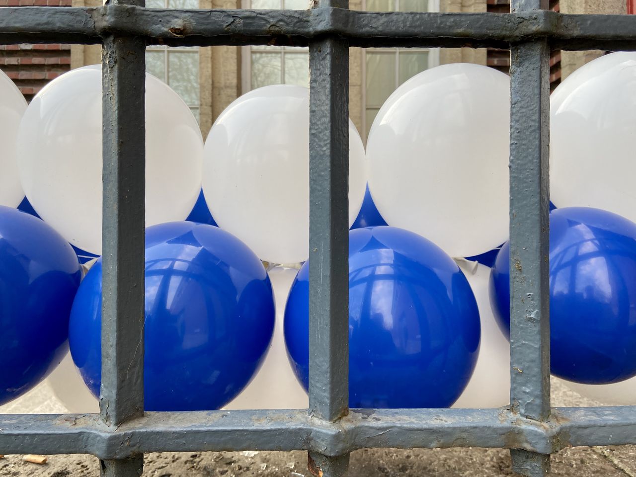 CLOSE-UP OF WHITE BALLOONS