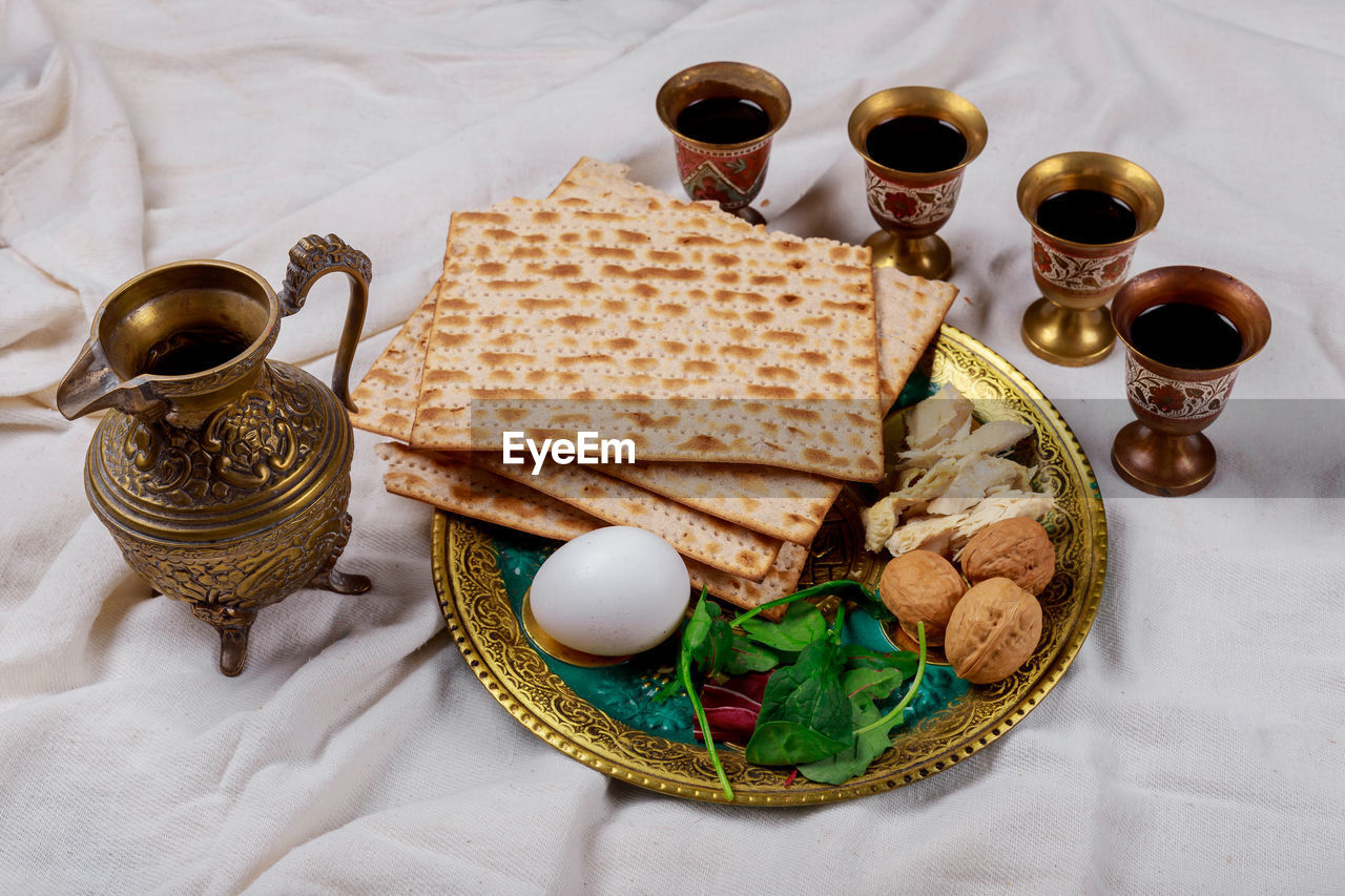 HIGH ANGLE VIEW OF VARIOUS FOOD ON TABLE WITH SPOON