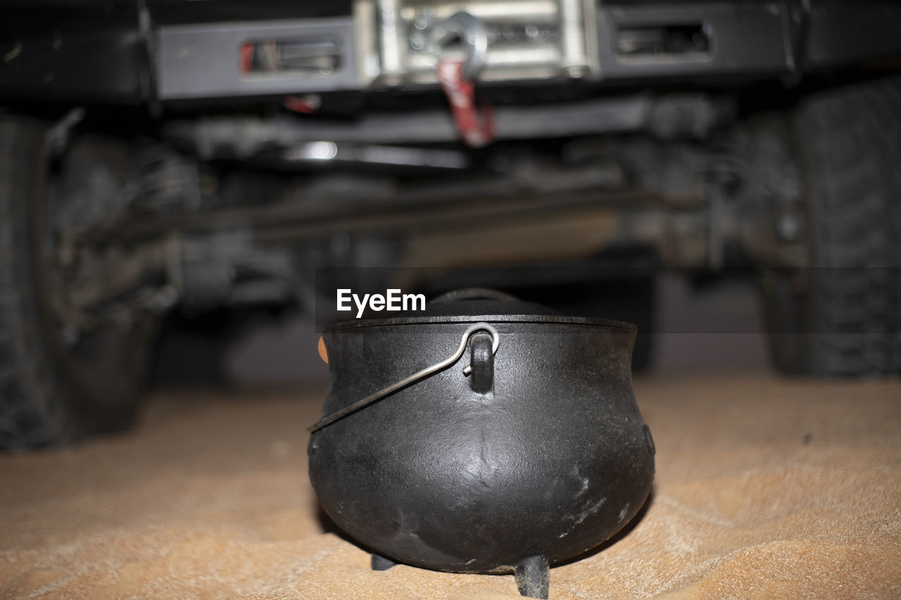 Close-up of south african potjie in front of an suv