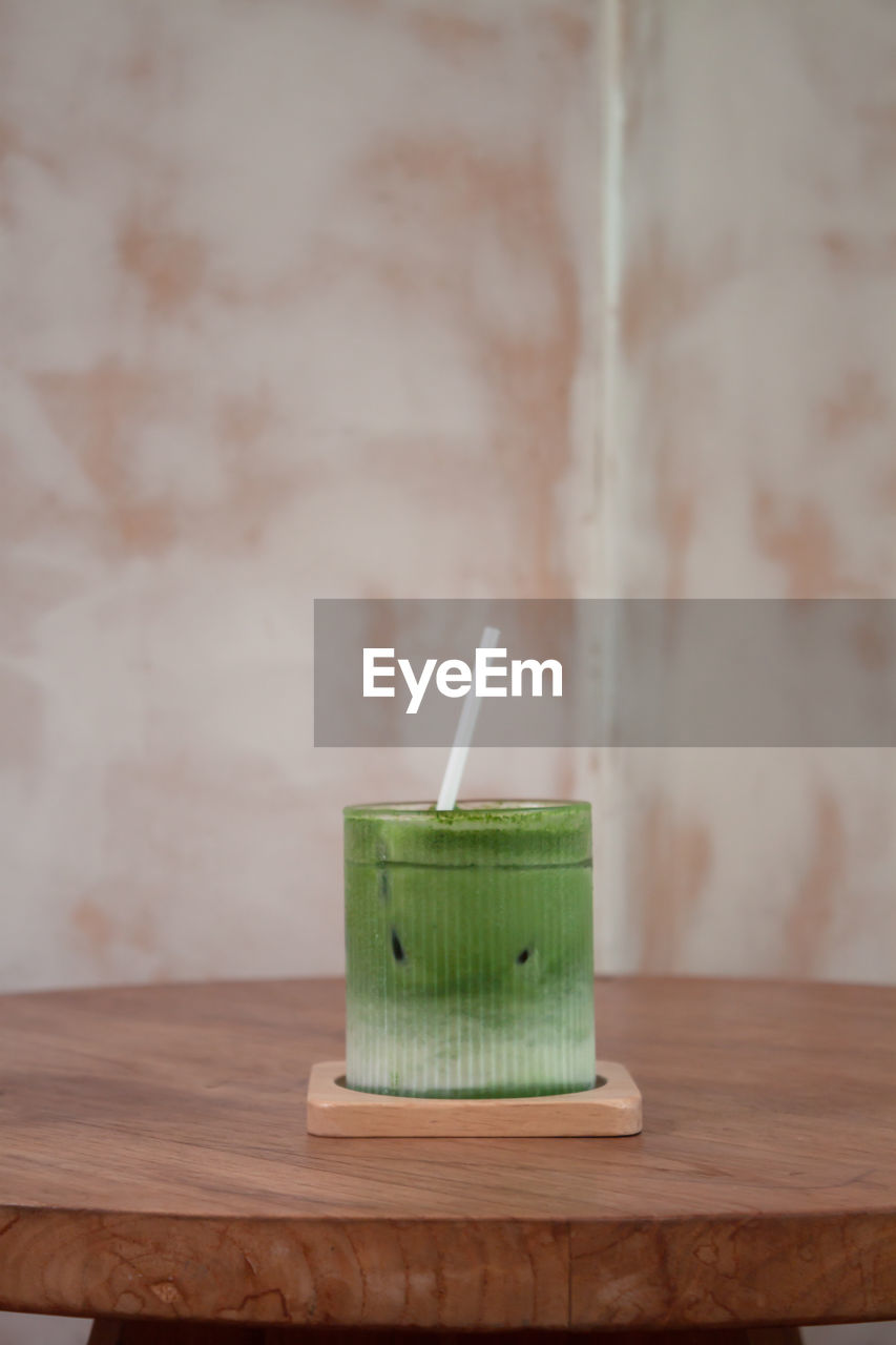 green, indoors, lighting, wood, food and drink, no people, table, candle, drinking straw, drink, straw, food, refreshment, wellbeing, focus on foreground, still life, healthy eating, freshness, wall - building feature, close-up