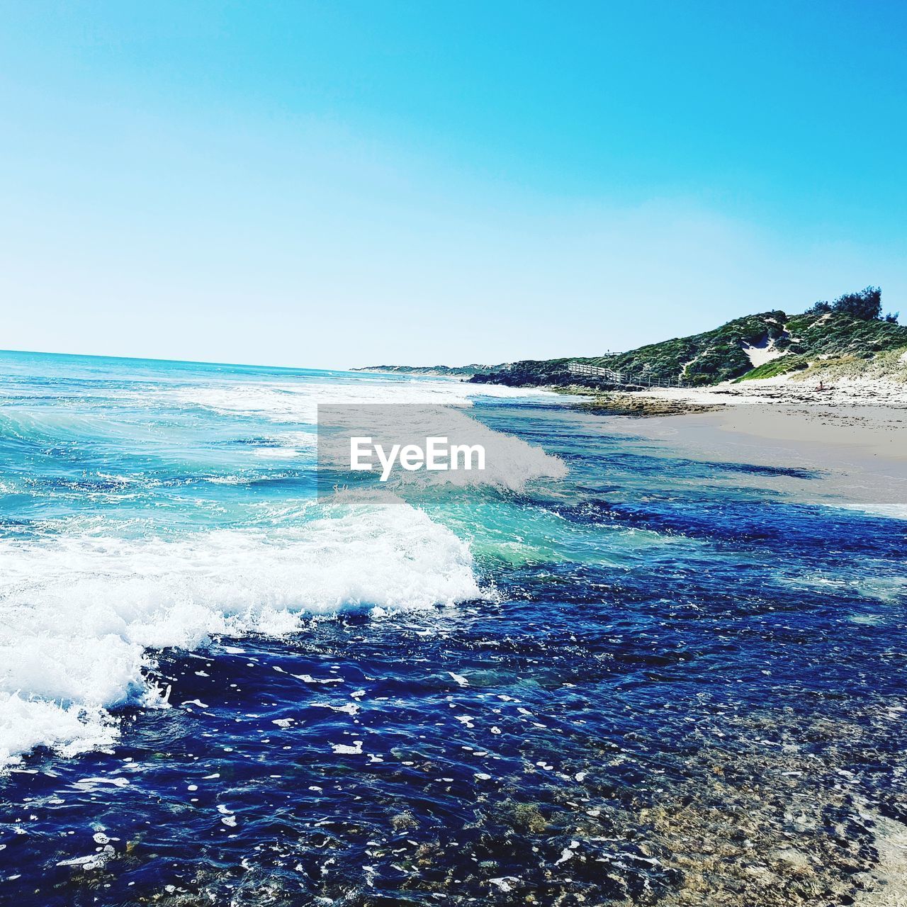 SCENIC VIEW OF SEA AGAINST BLUE SKY