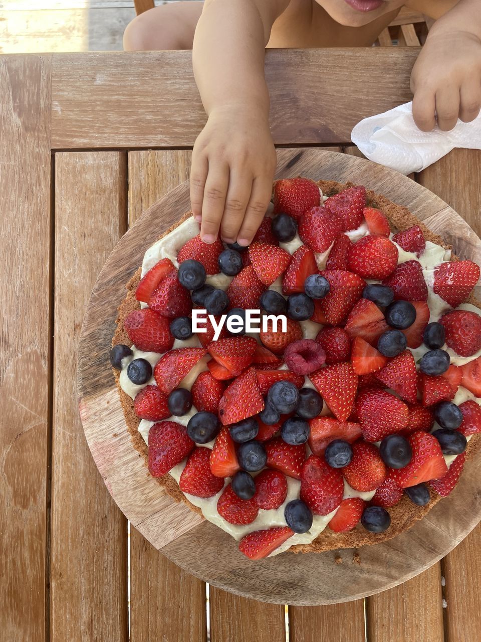 A impatient little baby with a adoration for fruits