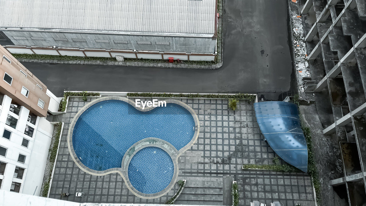 urban area, architecture, built structure, building exterior, city, day, no people, high angle view, stadium, outdoors, facade, sport venue, wall, building