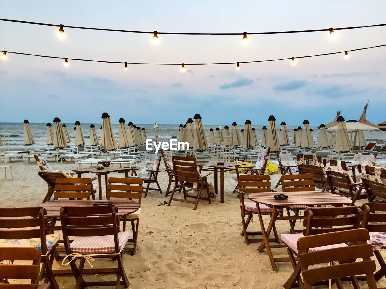 Empty restaurant on the beach at dusk