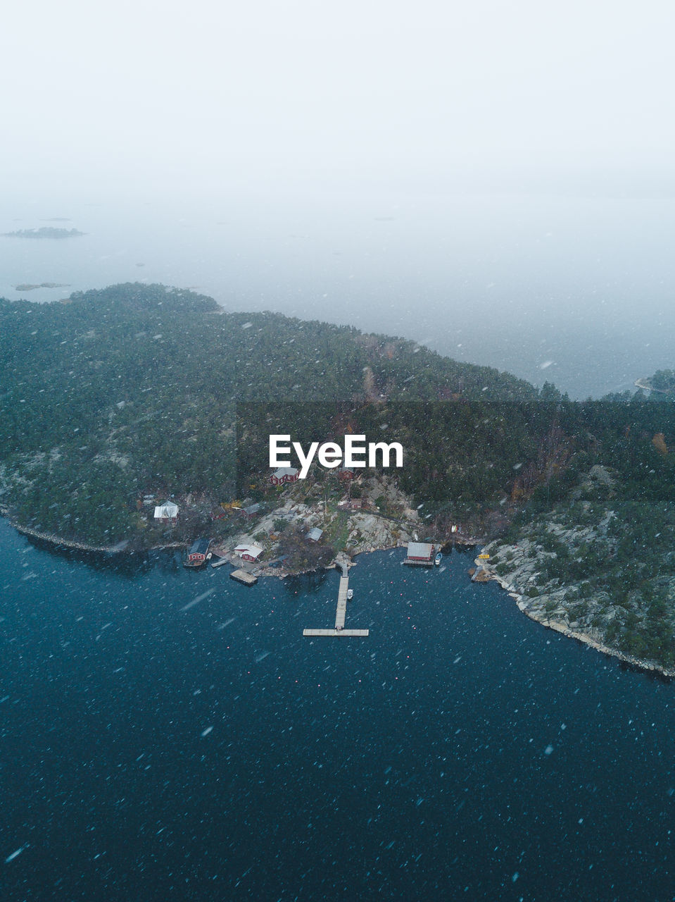 Aerial view of brännskär guest harbor in snow