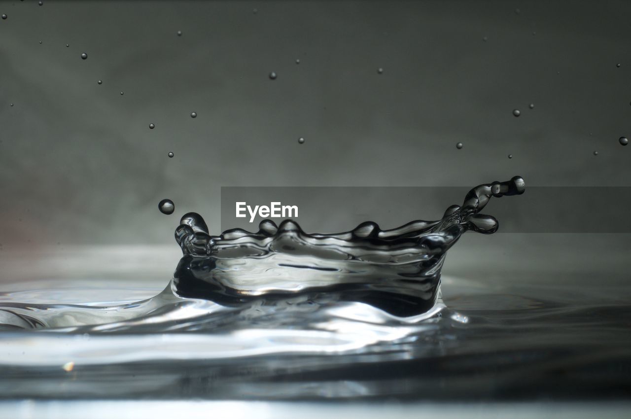 CLOSE-UP OF WATER SPLASHING IN SURFACE