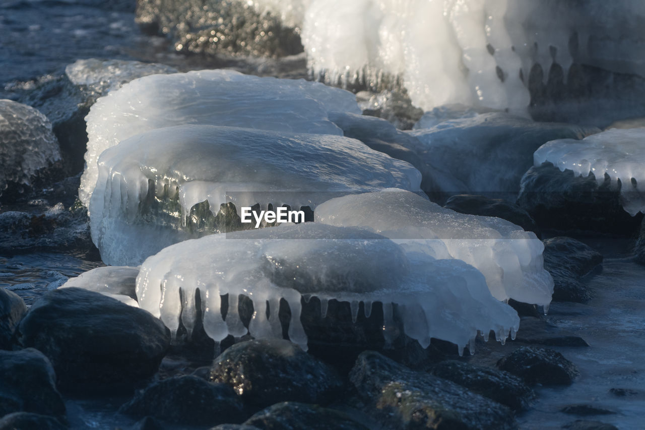 ice, freezing, water, winter, cold temperature, frozen, nature, sea, environment, wave, beauty in nature, snow, glacier, landscape, wind wave, no people, melting, iceberg, land, scenics - nature, outdoors, beach, rock, polar climate, ocean, travel destinations, non-urban scene, tranquility, travel, day, animal wildlife