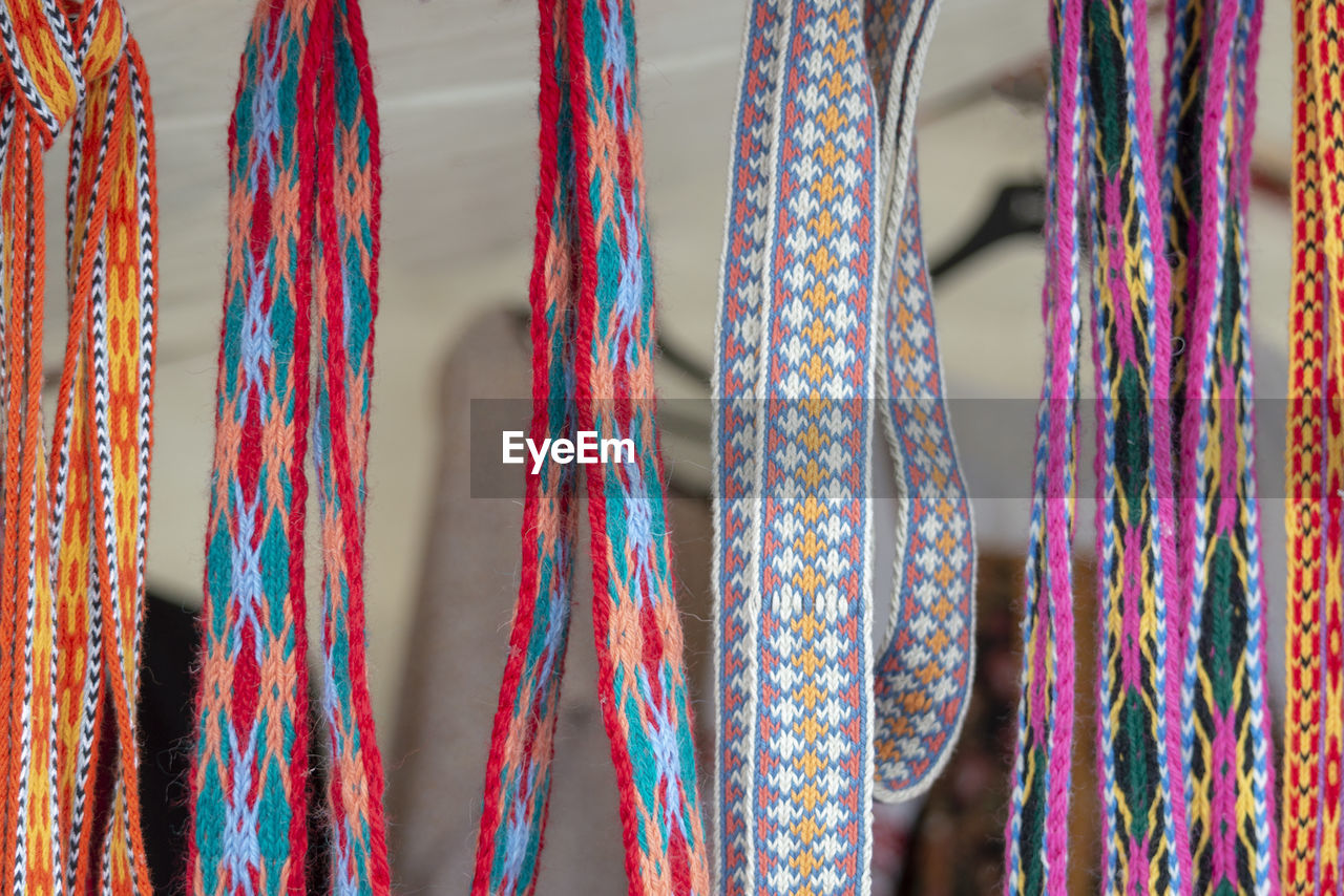 Close-up shot of laces hanging in store