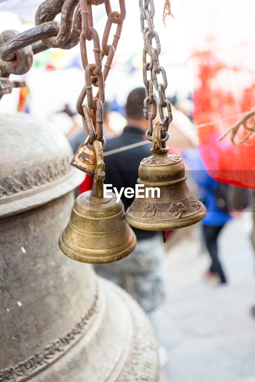 Close-up of bells hanging at temple