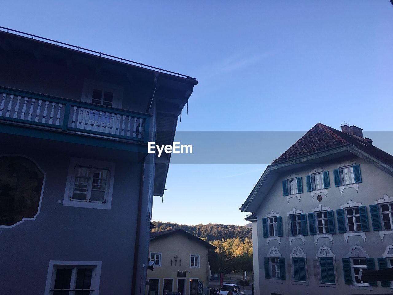 EXTERIOR OF HOUSES AGAINST BLUE SKY