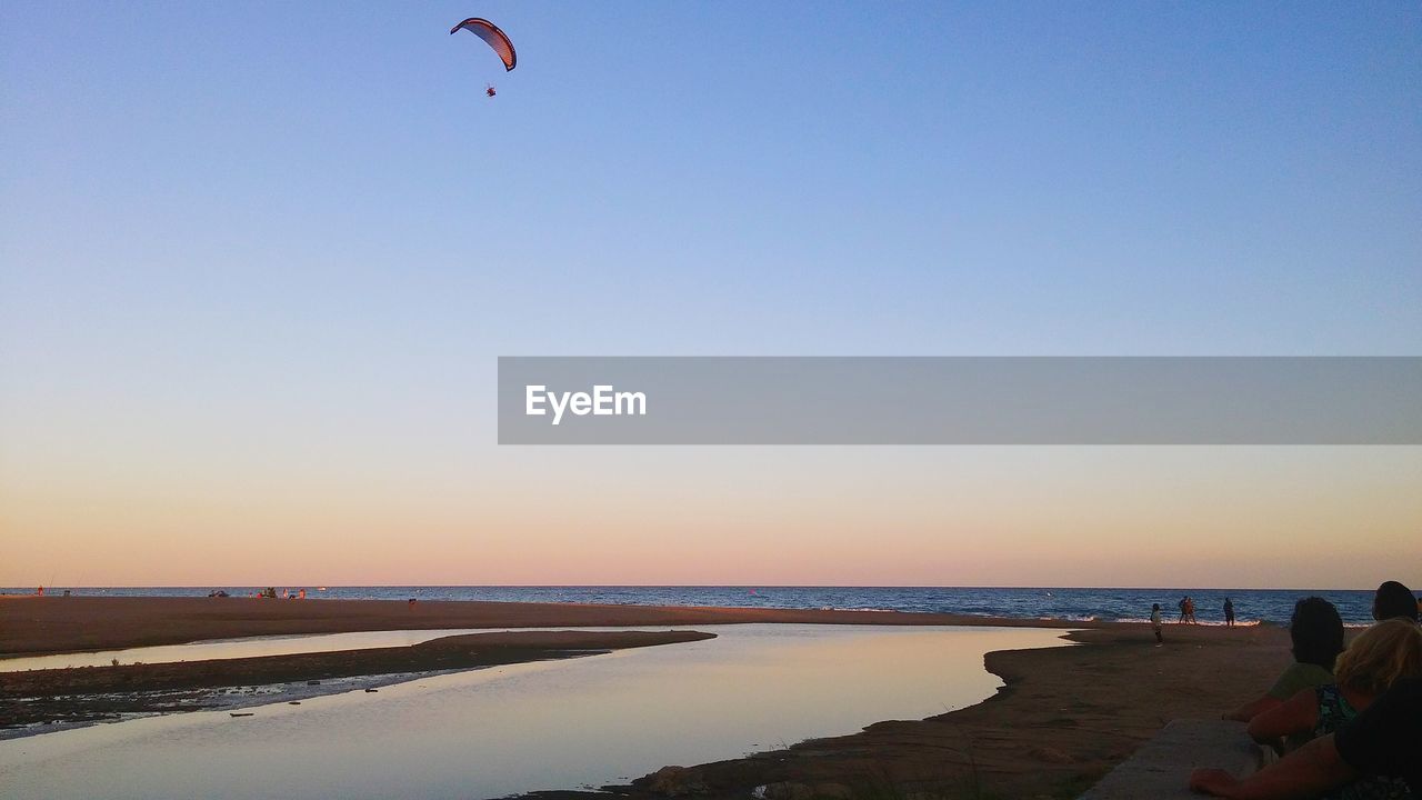 Scenic view of beach and sea against sky during sunset