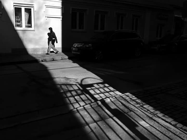 WOMAN WALKING ON CITY STREET