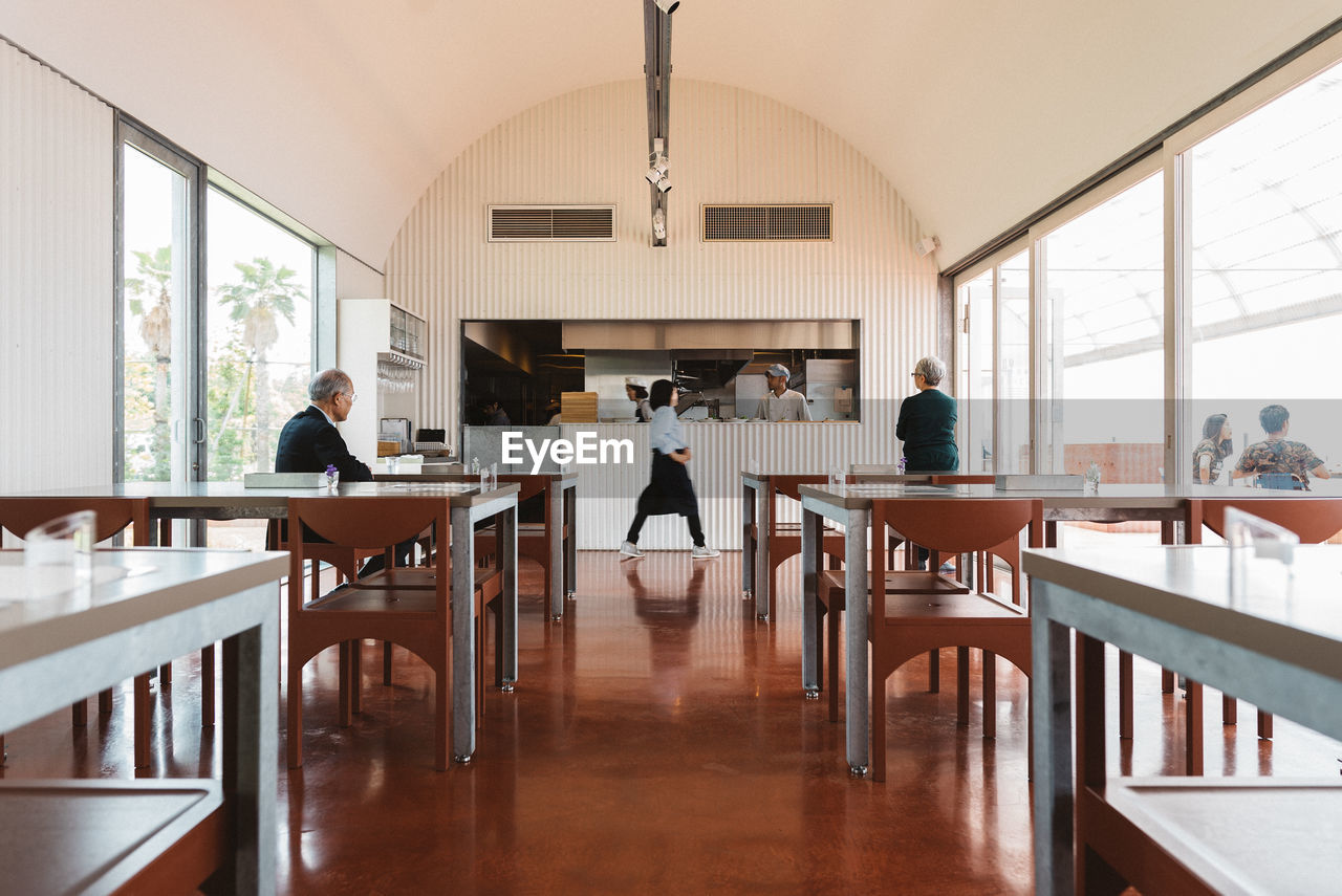 PEOPLE SITTING IN RESTAURANT