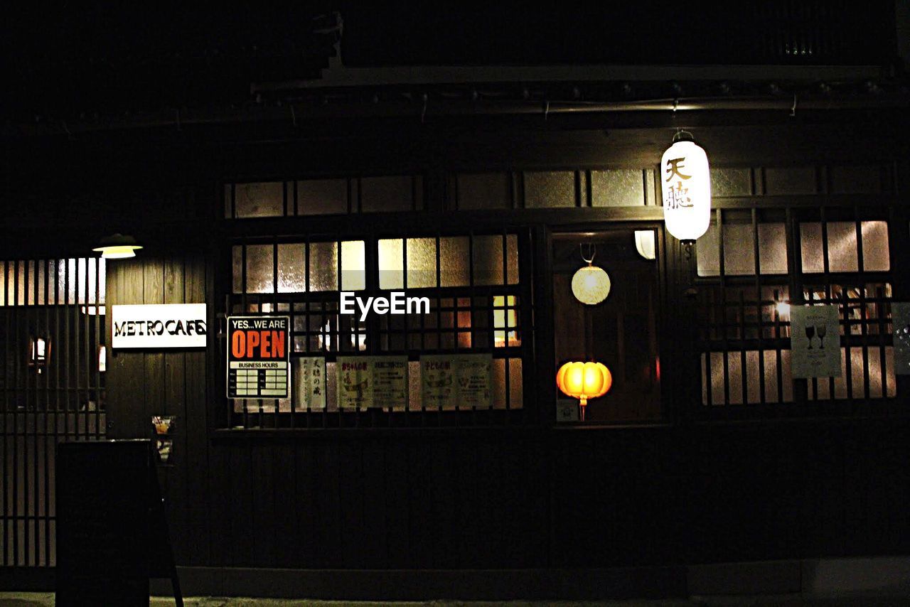 ILLUMINATED TEXT ON SHELF IN BUILDING