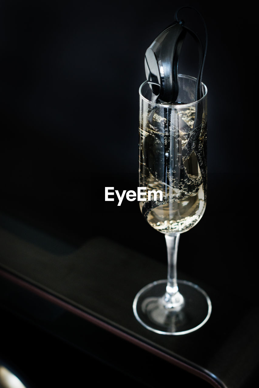 Close-up of wine in glass on table