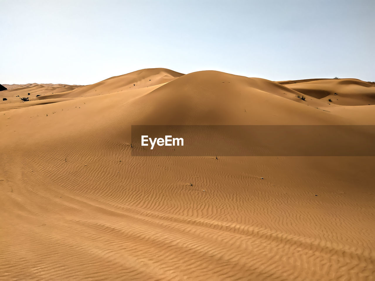 Scenic view of desert against clear sky