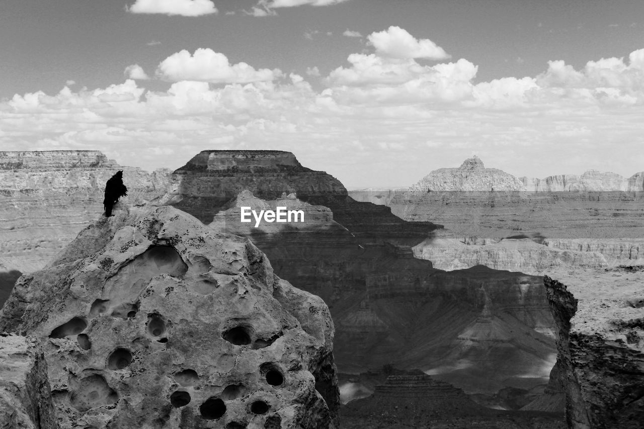 SCENIC VIEW OF ROCK FORMATIONS ON COAST