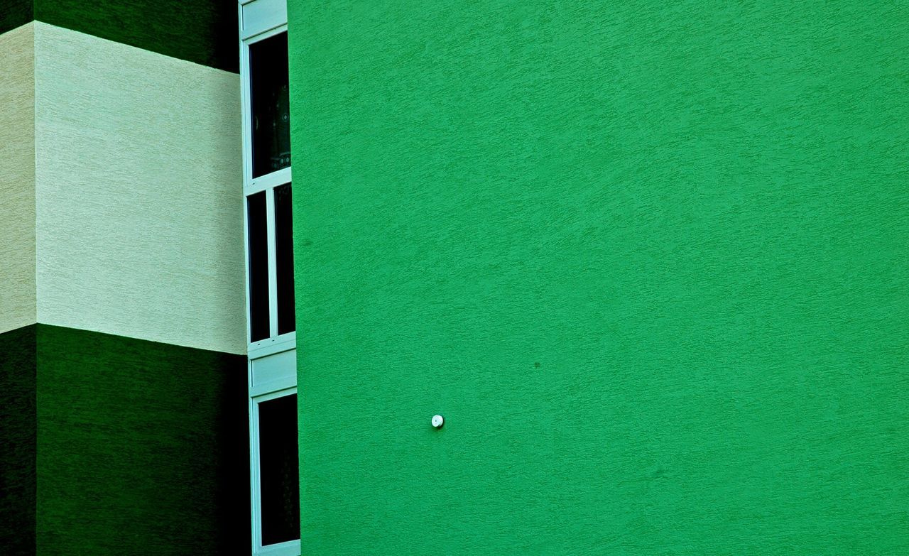 Low angle view of green painted building