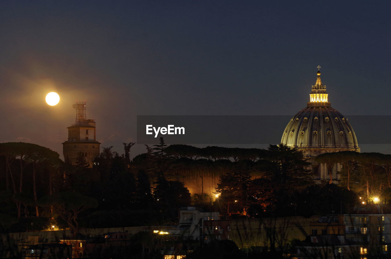 A roman night landscape with san peter cathedral and the moon