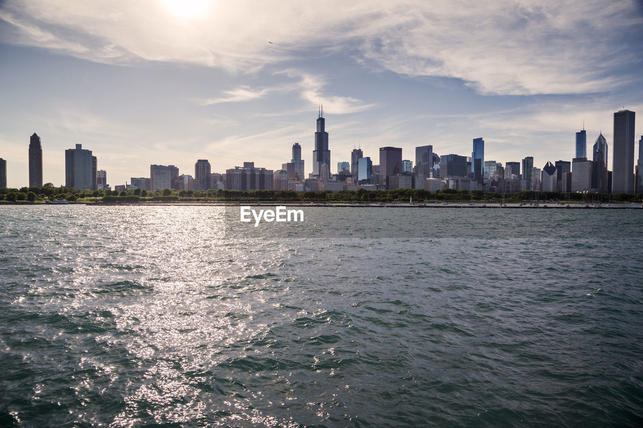 Sea with buildings in background