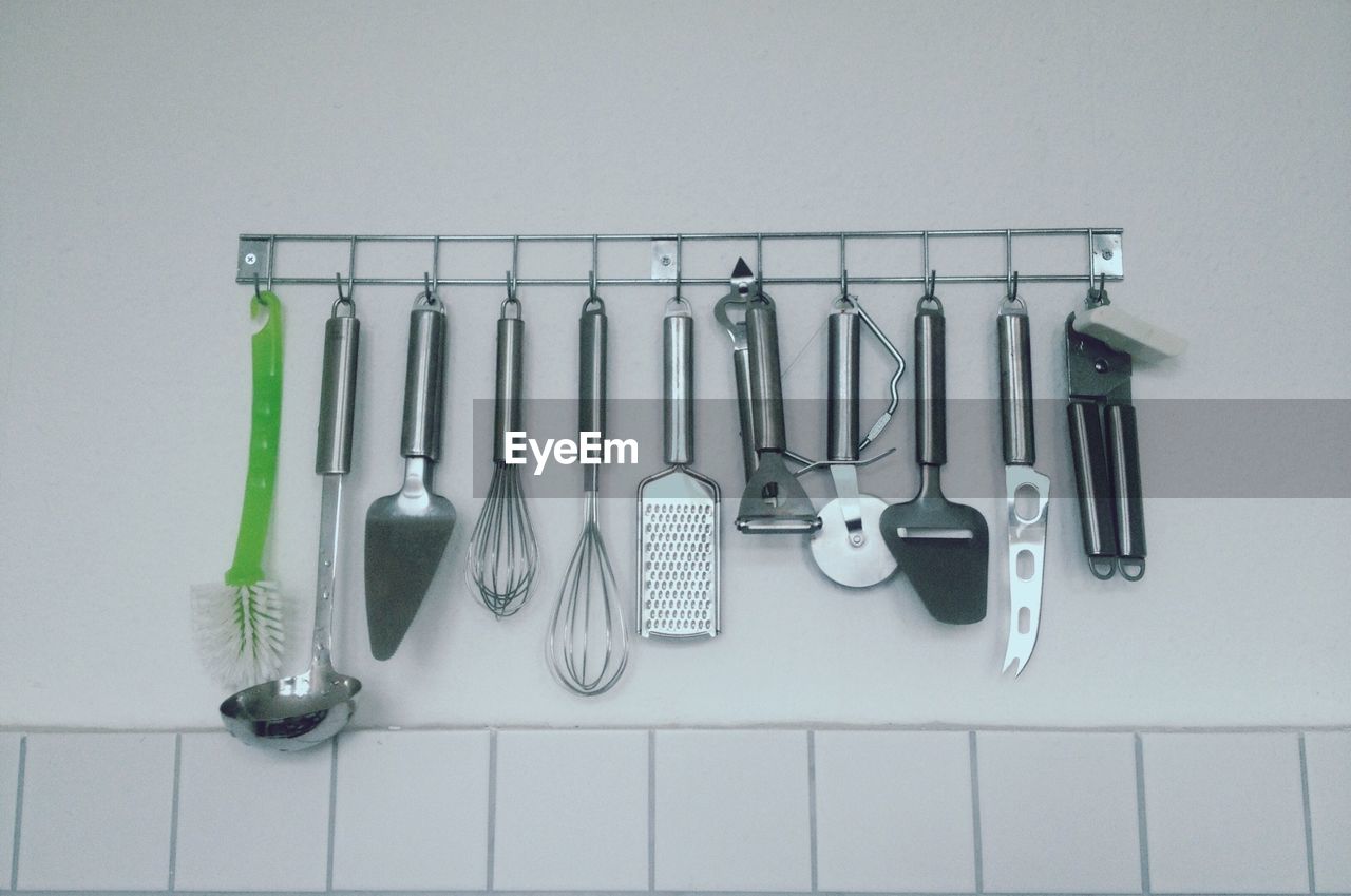 Assorted utensils hanging in a kitchen