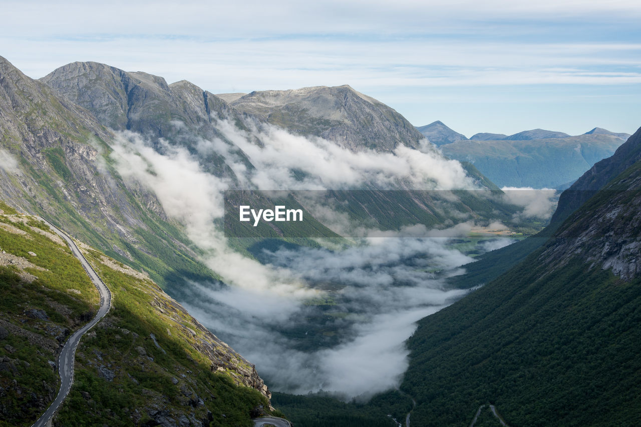 High angle view of mountain range against cloudy sky