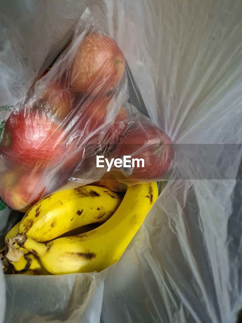 banana, fruit, food, produce, plastic, yellow, healthy eating, food and drink, freshness, no people, plastic bag, wellbeing, plant, close-up, flower, indoors