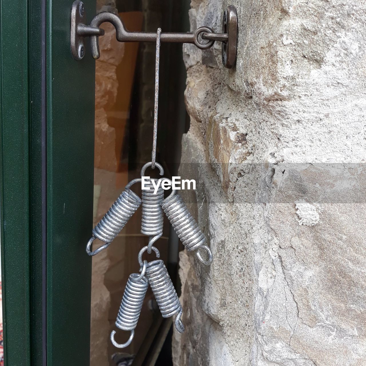 Close-up of springs hanging on rock