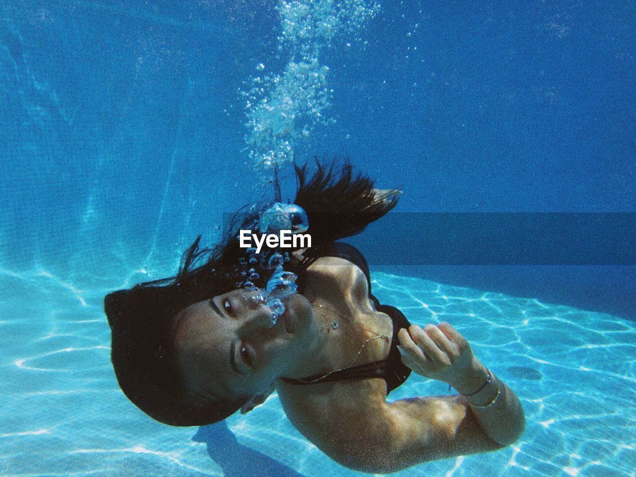 Portrait of woman swimming in pool